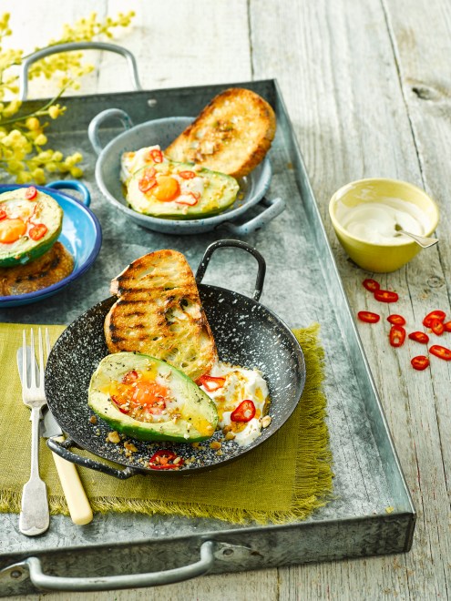 Avocado baked eggs with spiced hazelnuts