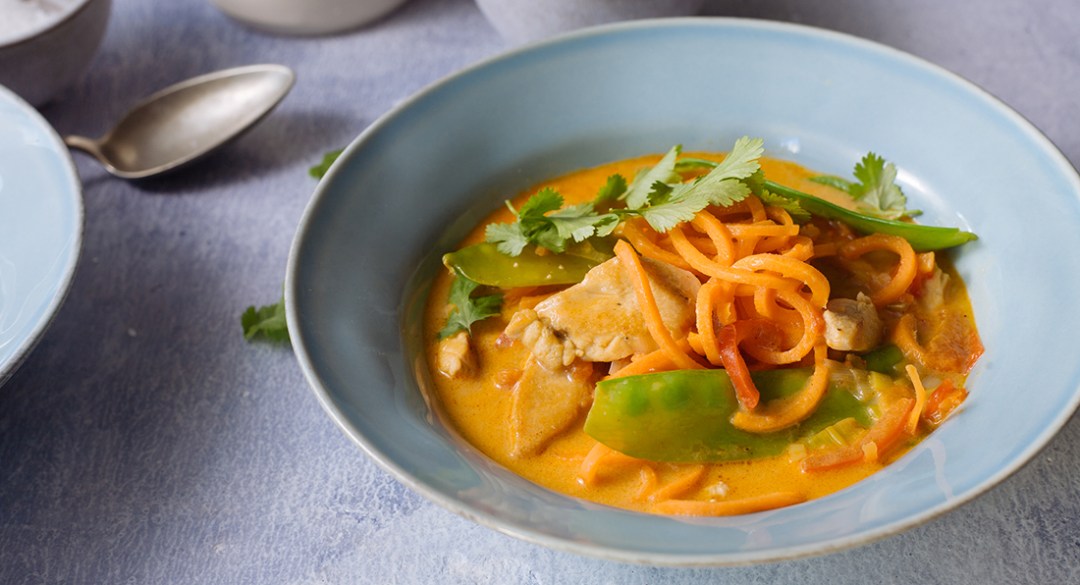 Spicy tom yum chicken and coconut soup with carrot noodles