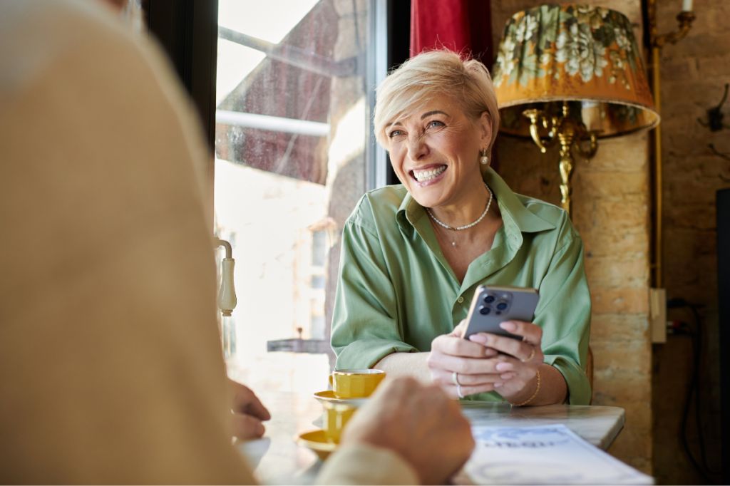 woman smiling at man adoringly in restaurant