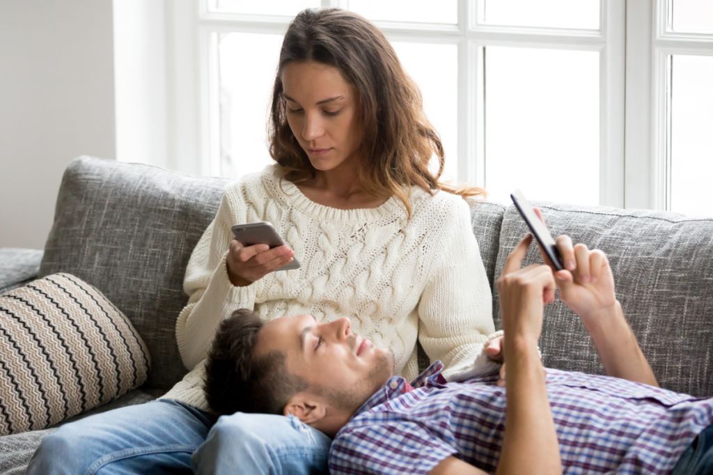 Couple distracted by phones