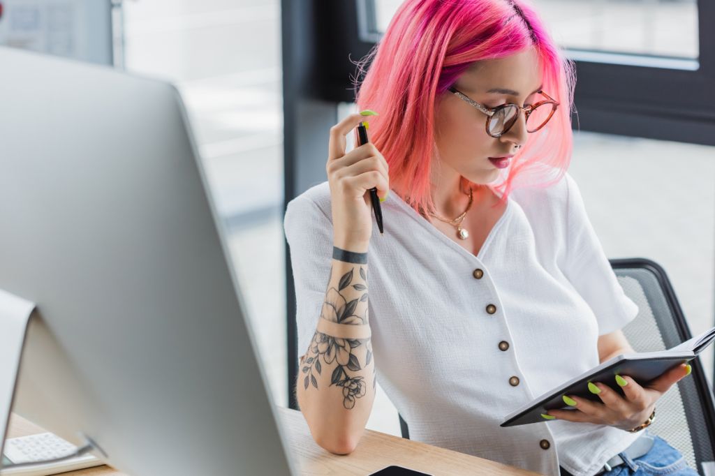 woman with pink hair living aligned with values, reclaiming joy through creativity
