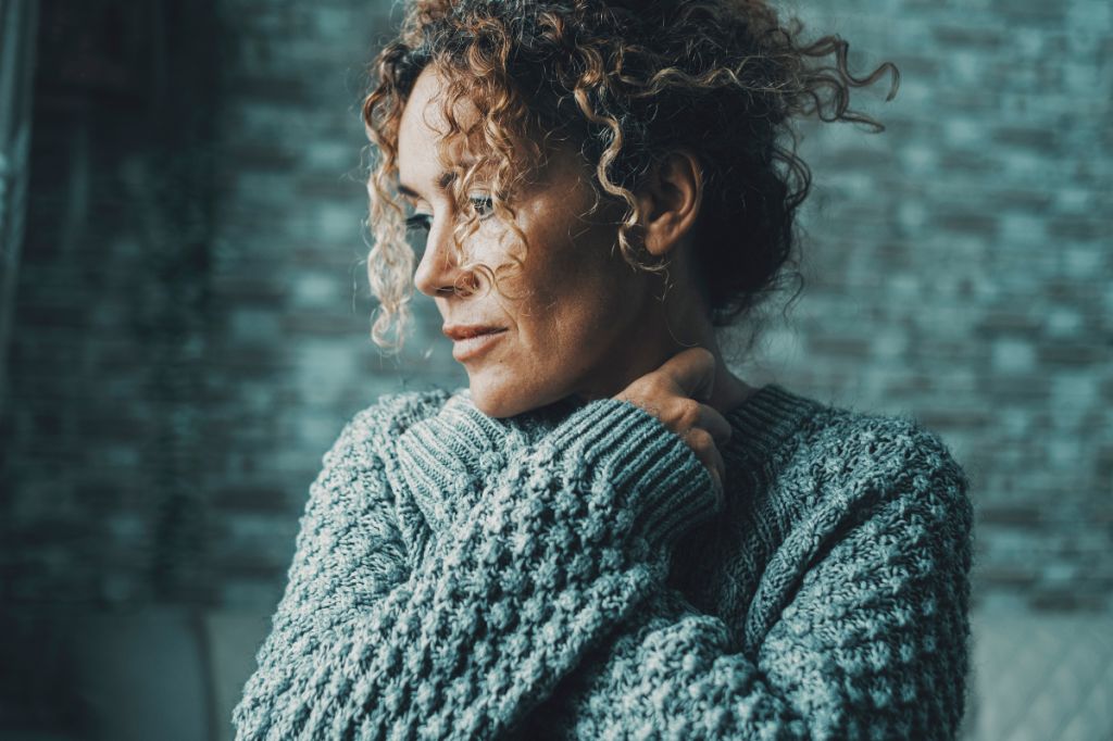 Woman sad isolated by relationship red flag
