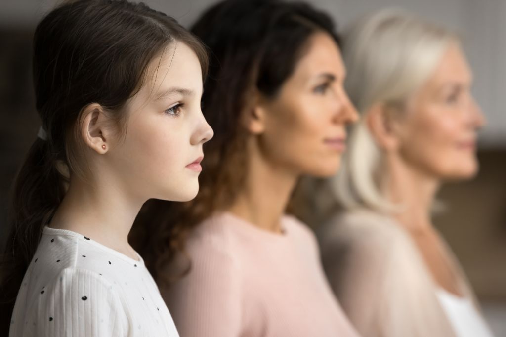 Three generations of women sit together