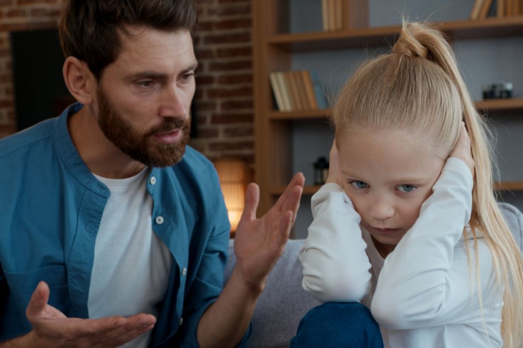 angry, narcissistic parent shouts at daughter