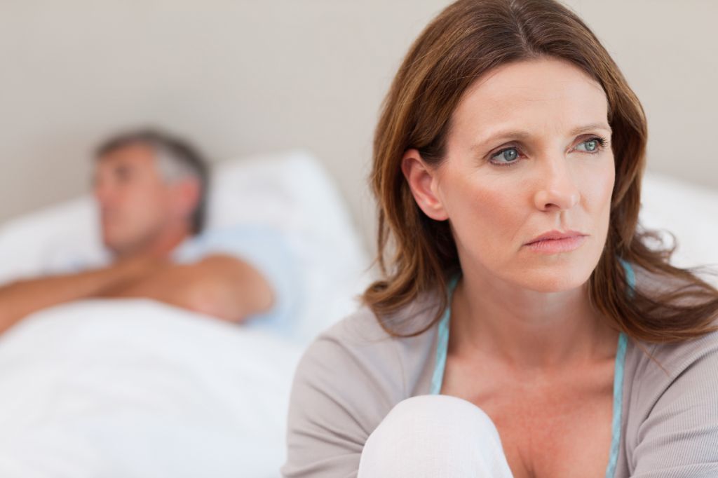 woman looks into distance, dreaming of a new life