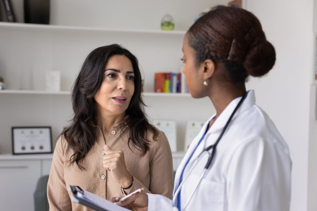 woman talking to doctor