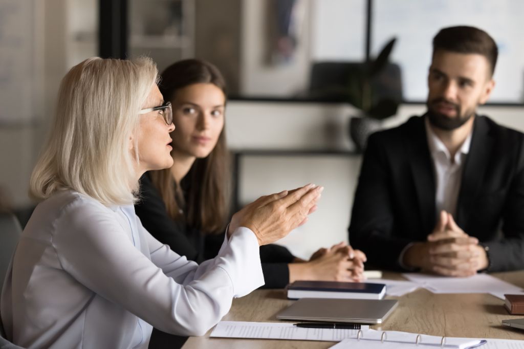 woman explains to colleagues