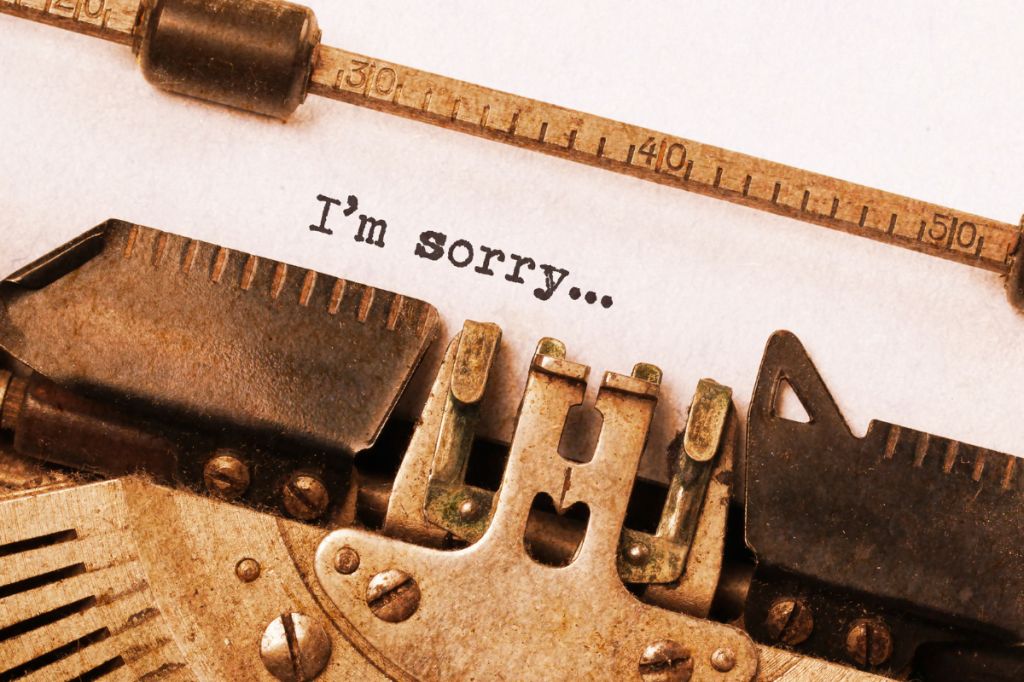 old fashioned typewriter with words I'm sorry typed on paper