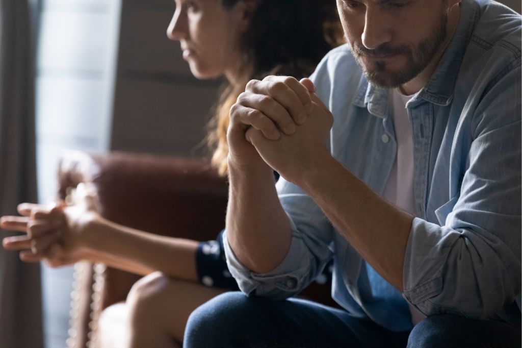 man and woman both thoughtful