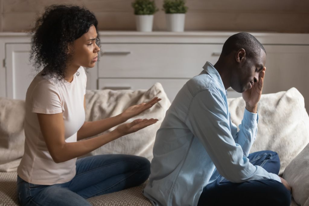Woman pleads with man who has his back to her