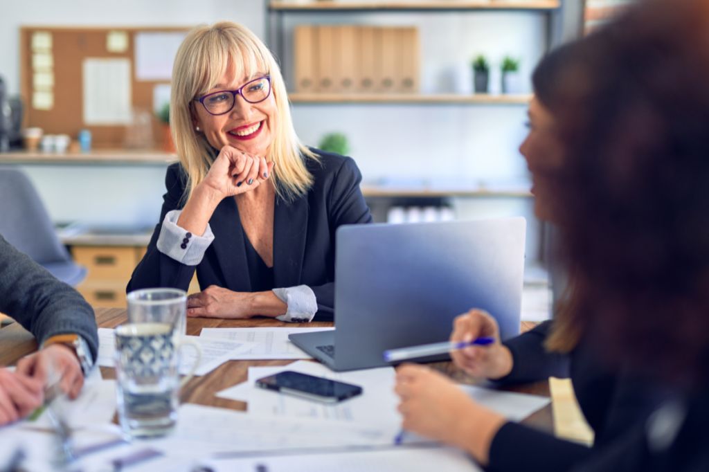 Woman impressed in team meeting