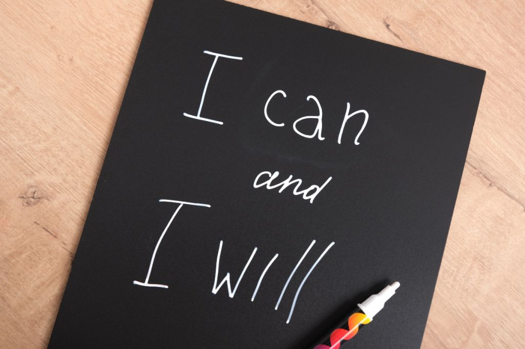 black paper with I can and I will written on it