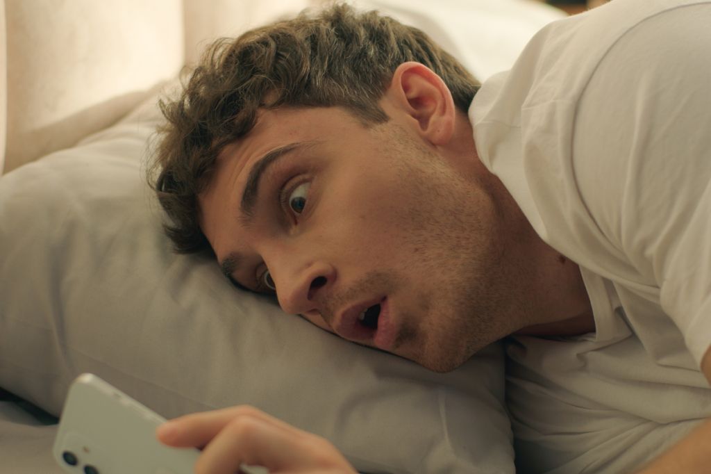man shocked by social media on phone