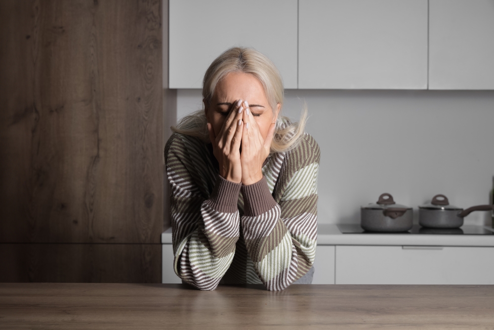 woman stressed masking OCD symptoms at home