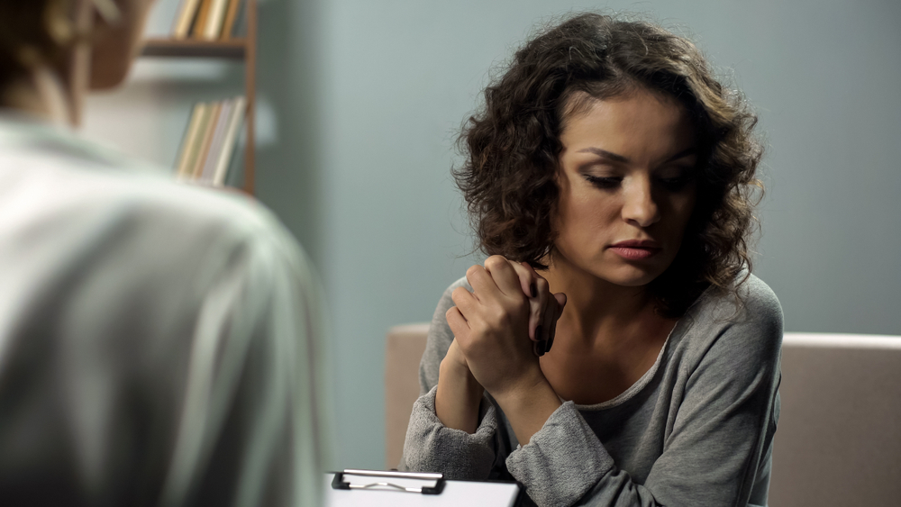 woman with OCD speaking to therapist