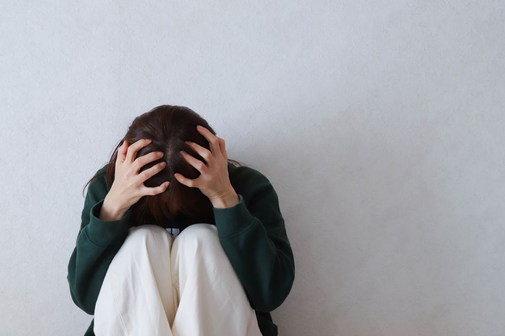woman feeling stressed and stuck in fight-or-flight nervous system state