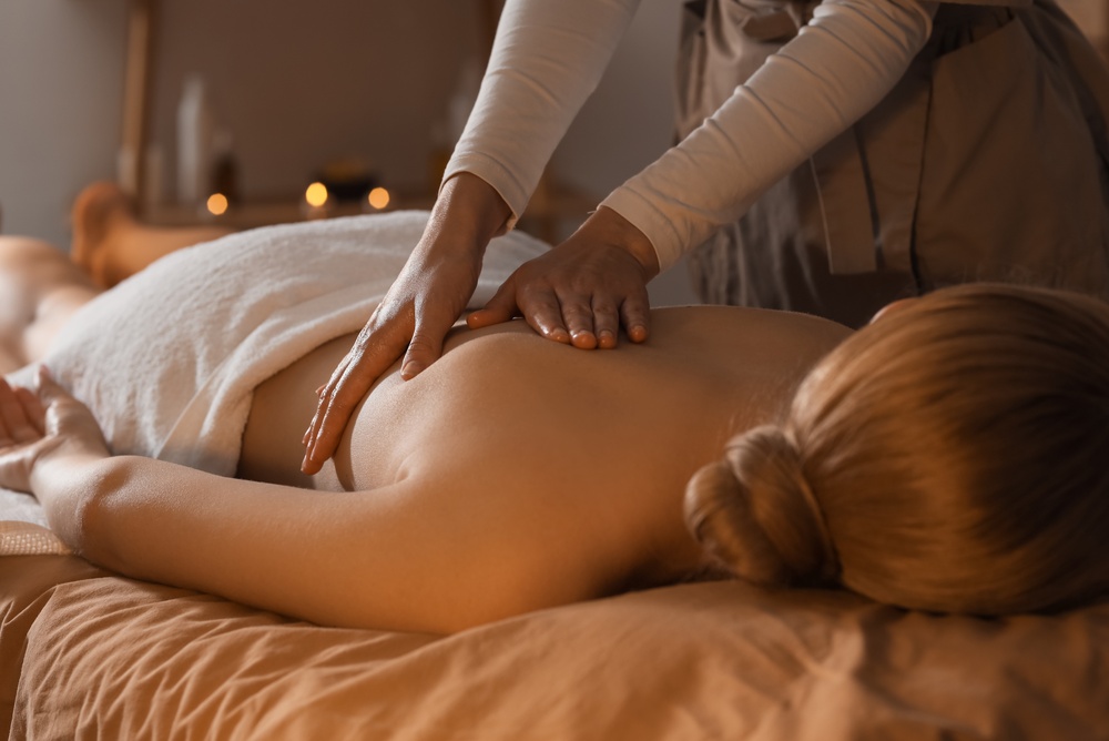 woman receives a massage treatment to ease muscle pain and tight fascia