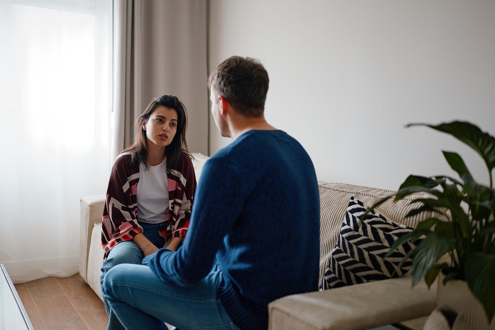 couple having a serious conversation, they are trying to resolve a repetitive argument