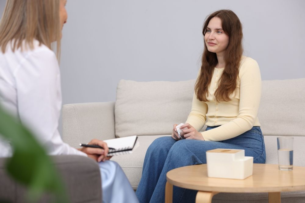 Young woman listening to a therapist