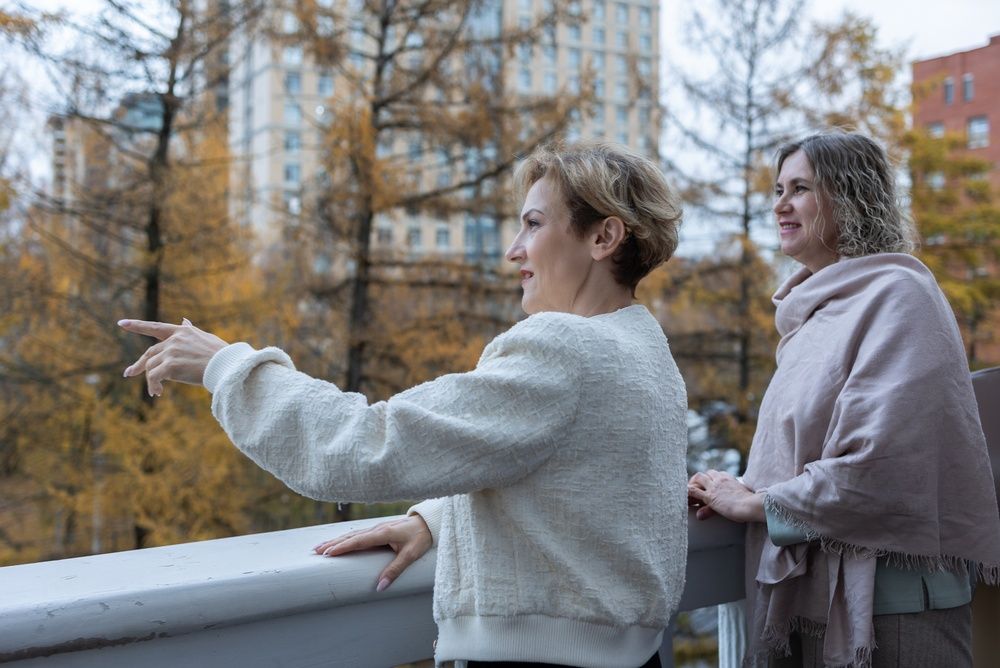 two midlife women talking in a friendly manner