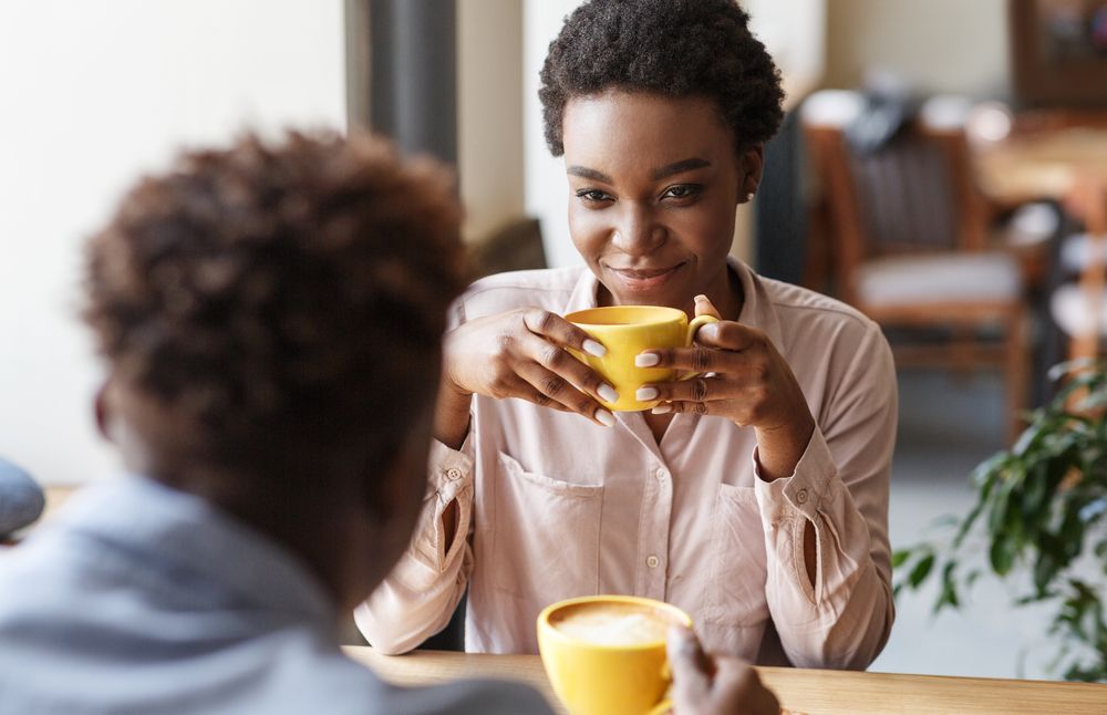 Young,Black,Couple,Drinking,Coffee,Together,On,Date,At,Cozy